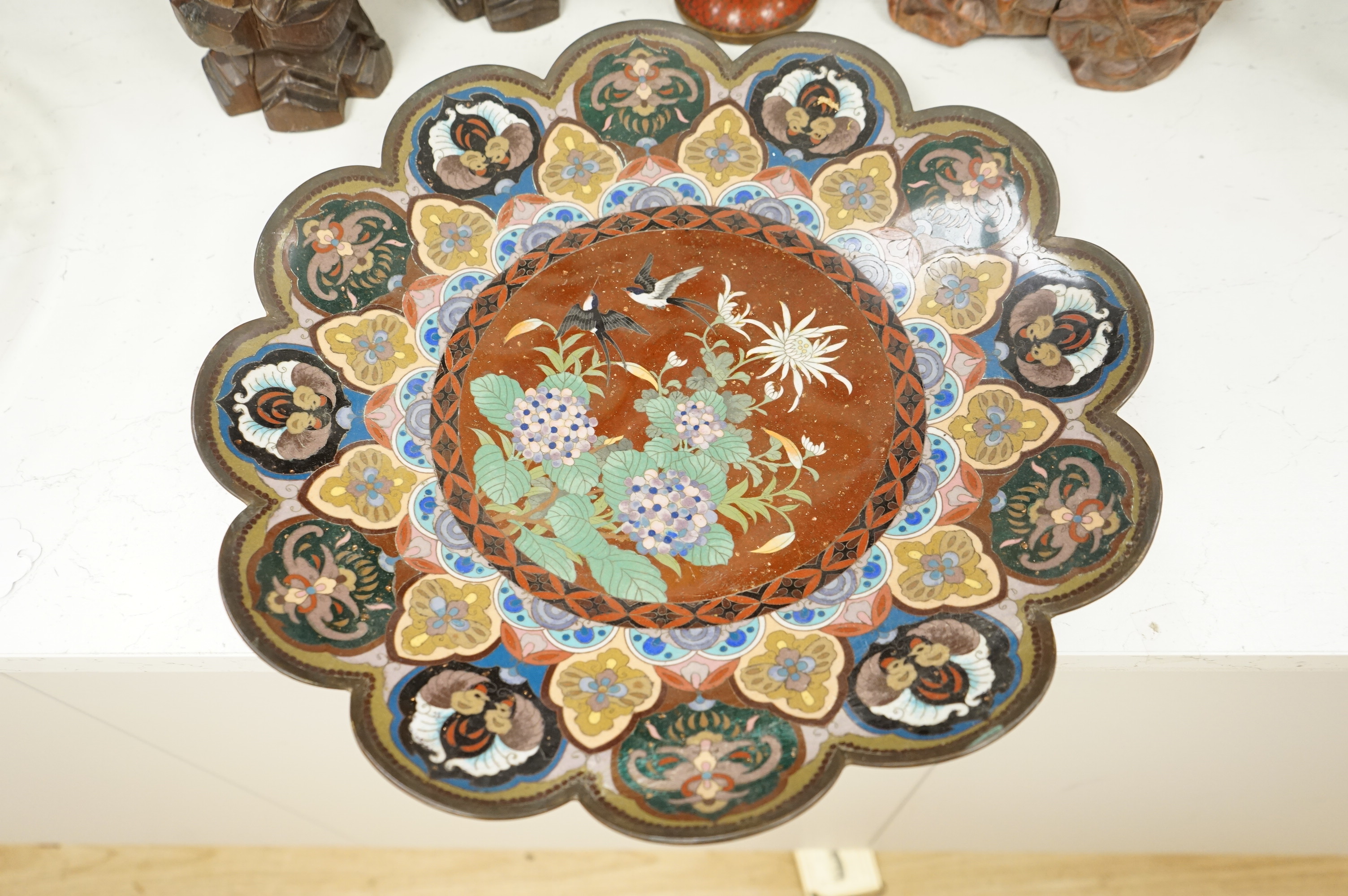 A Japanese cloisonné enamel dish, a Chinese cloisonné enamel vase and three Chinese carved wood figures, largest 39cm high